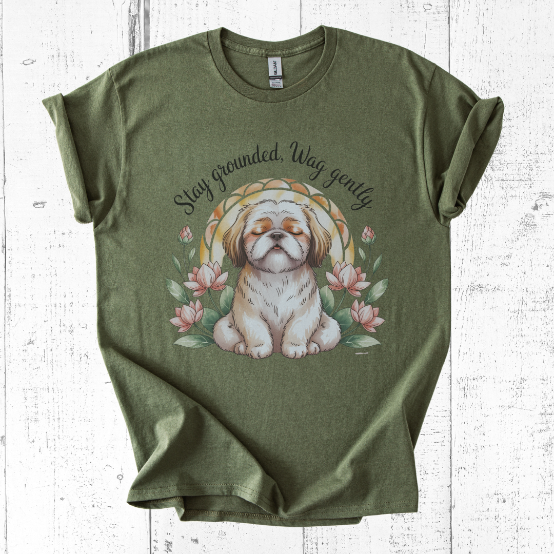 Green t-shirt with a dog graphic and text on a white wooden surface
