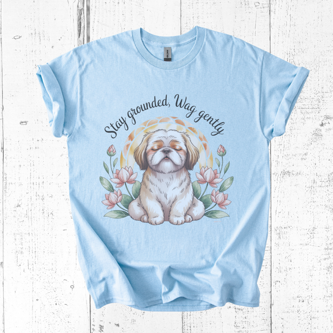 Light blue t-shirt with a dog illustration and text on a wooden surface