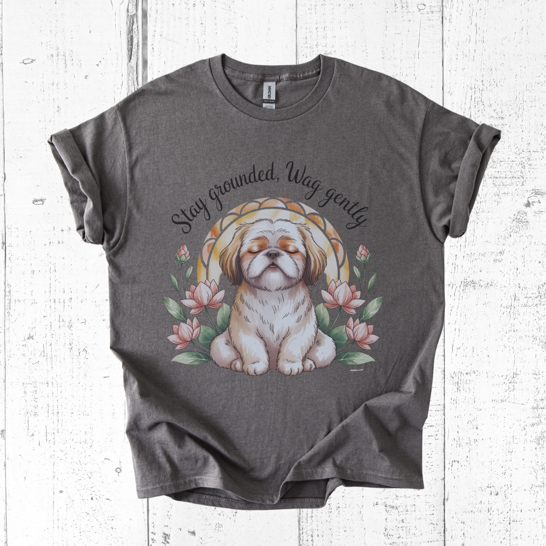 Gray t-shirt with a dog illustration and text on a wooden surface