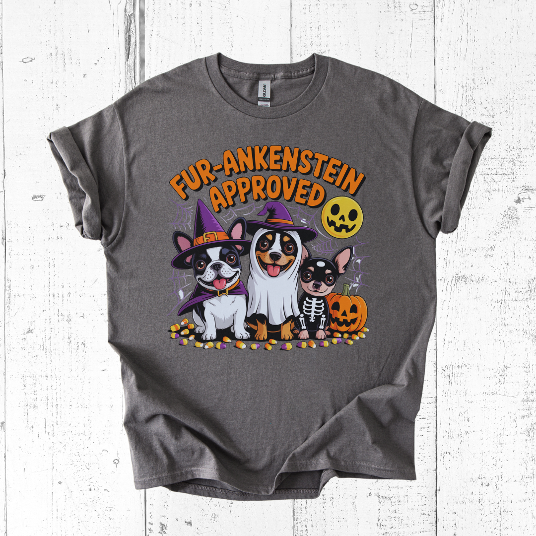 Gray t-shirt with Halloween-themed design featuring dogs and text on a white wooden background