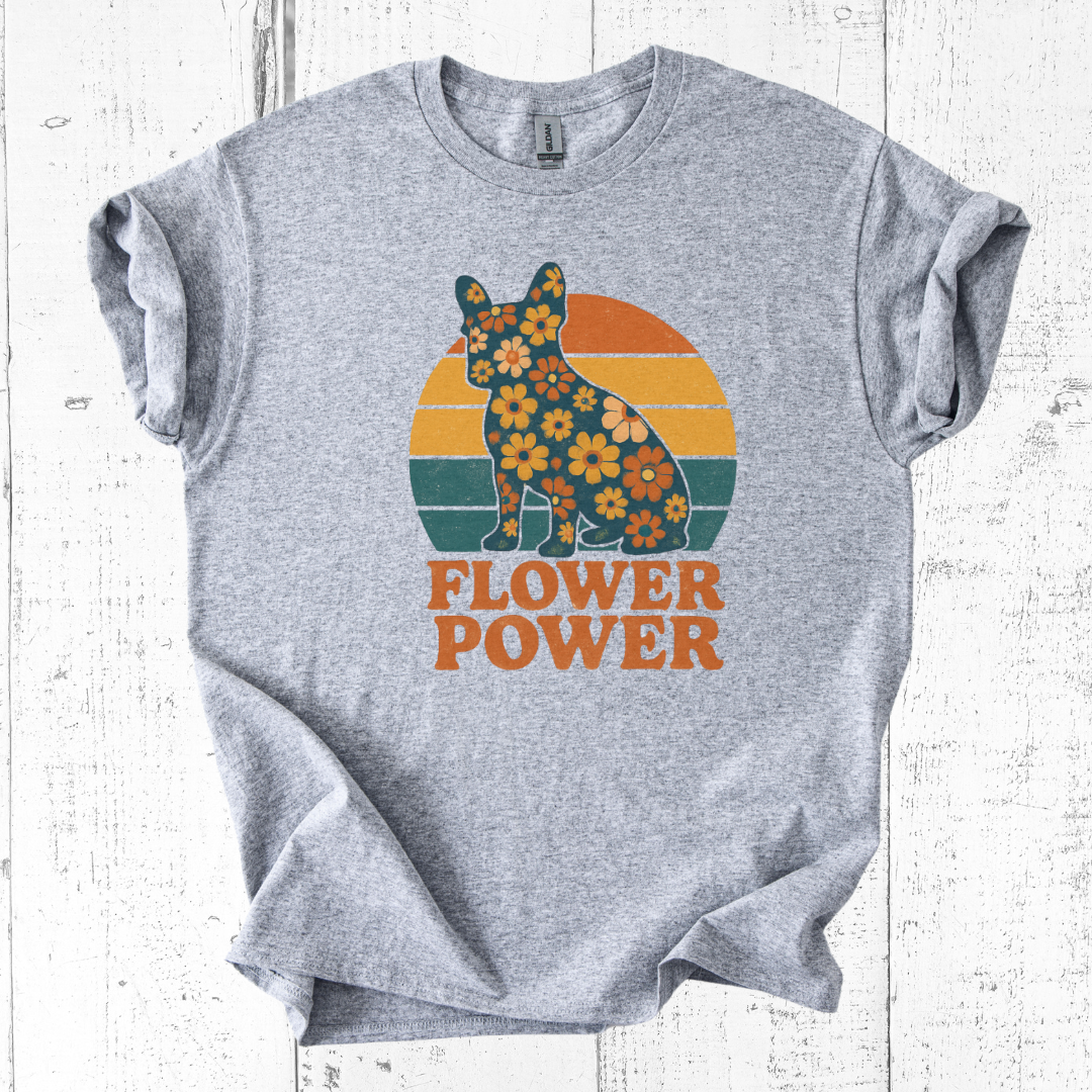 Gray t-shirt with a floral bear design and 'Flower Power' text on a white wooden background