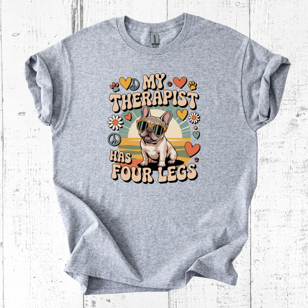 Gray t-shirt with a dog graphic and text on a white wooden background