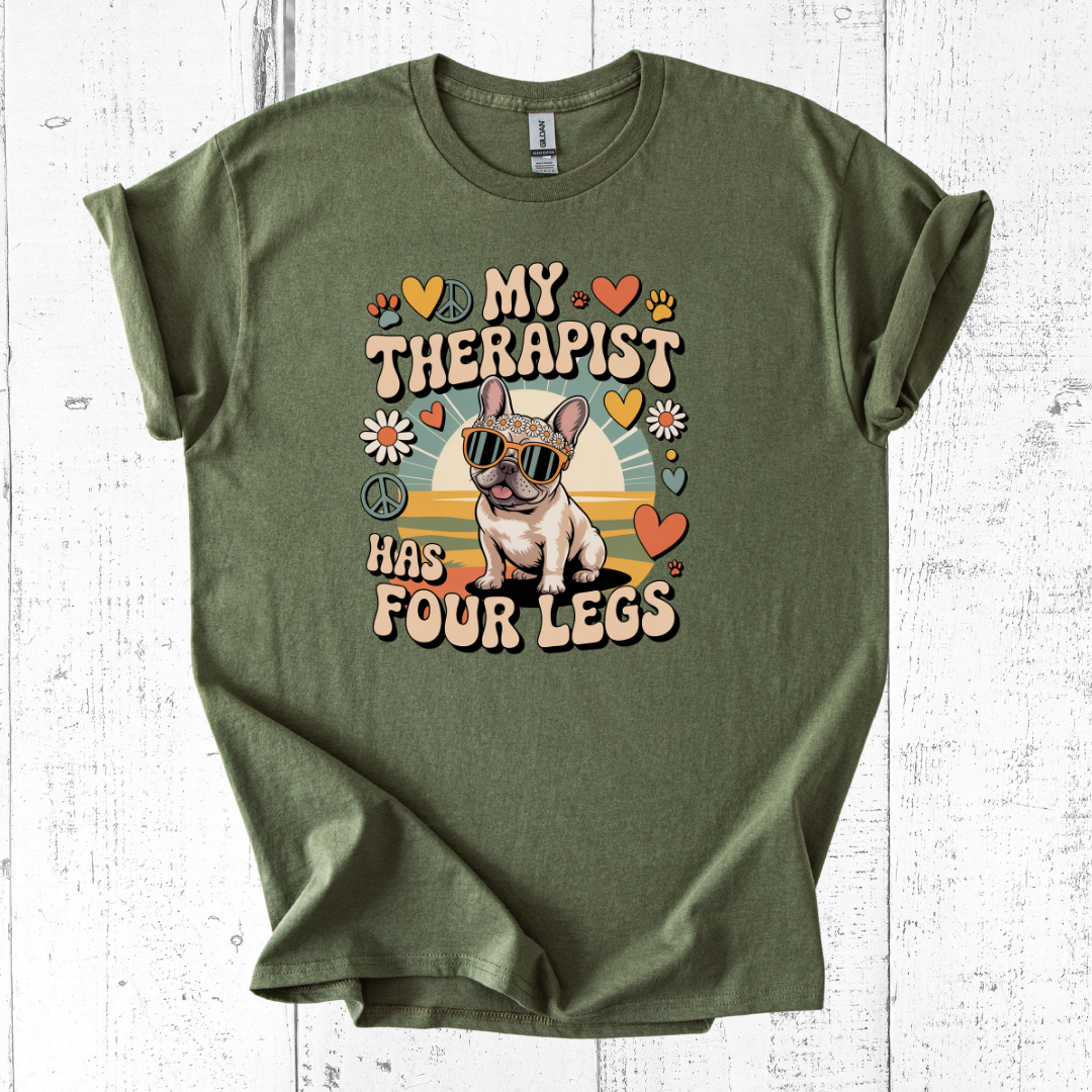 Green t-shirt with a dog graphic and text on a white wooden background