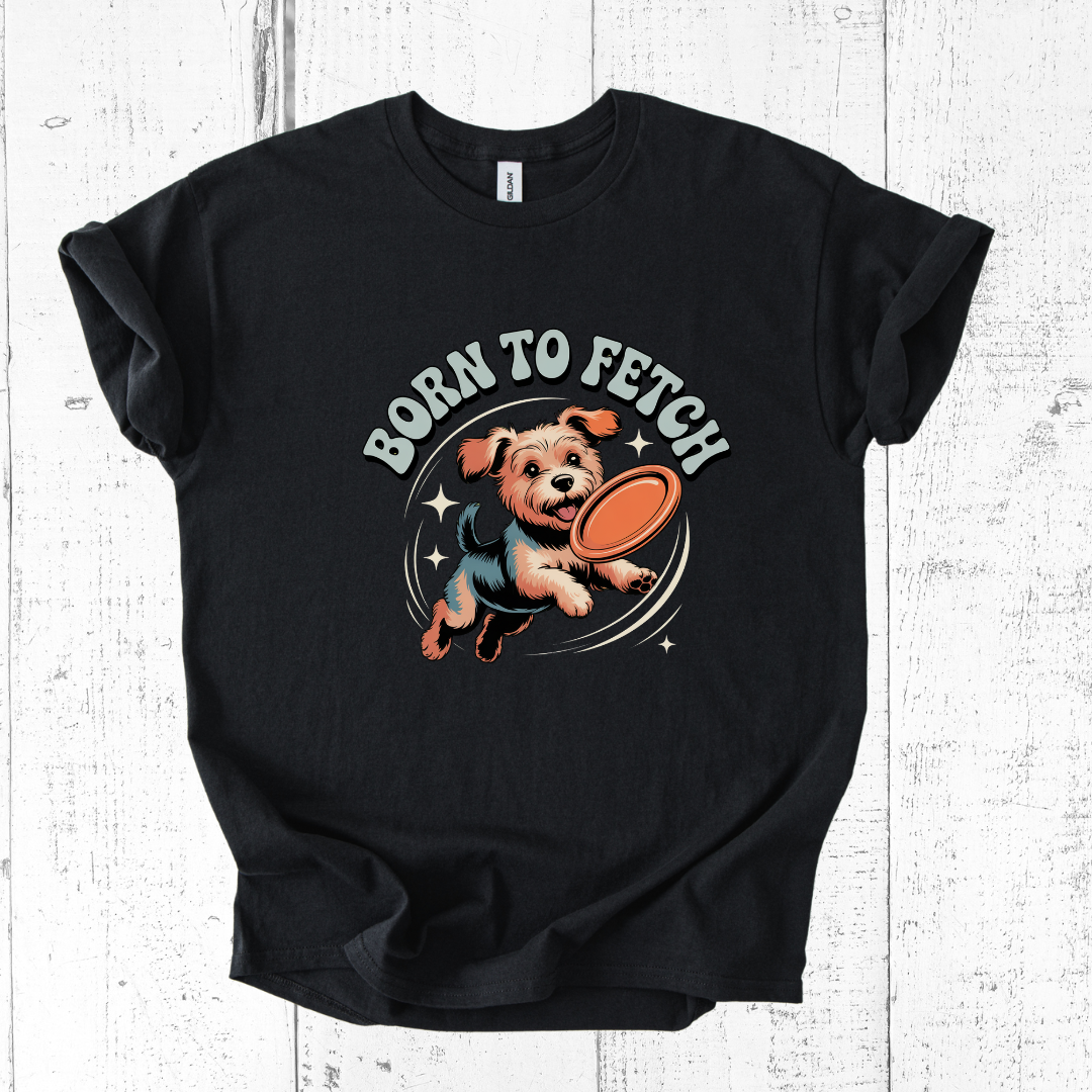 Black t-shirt with a dog graphic and 'Born to Fetch' text on a wooden surface