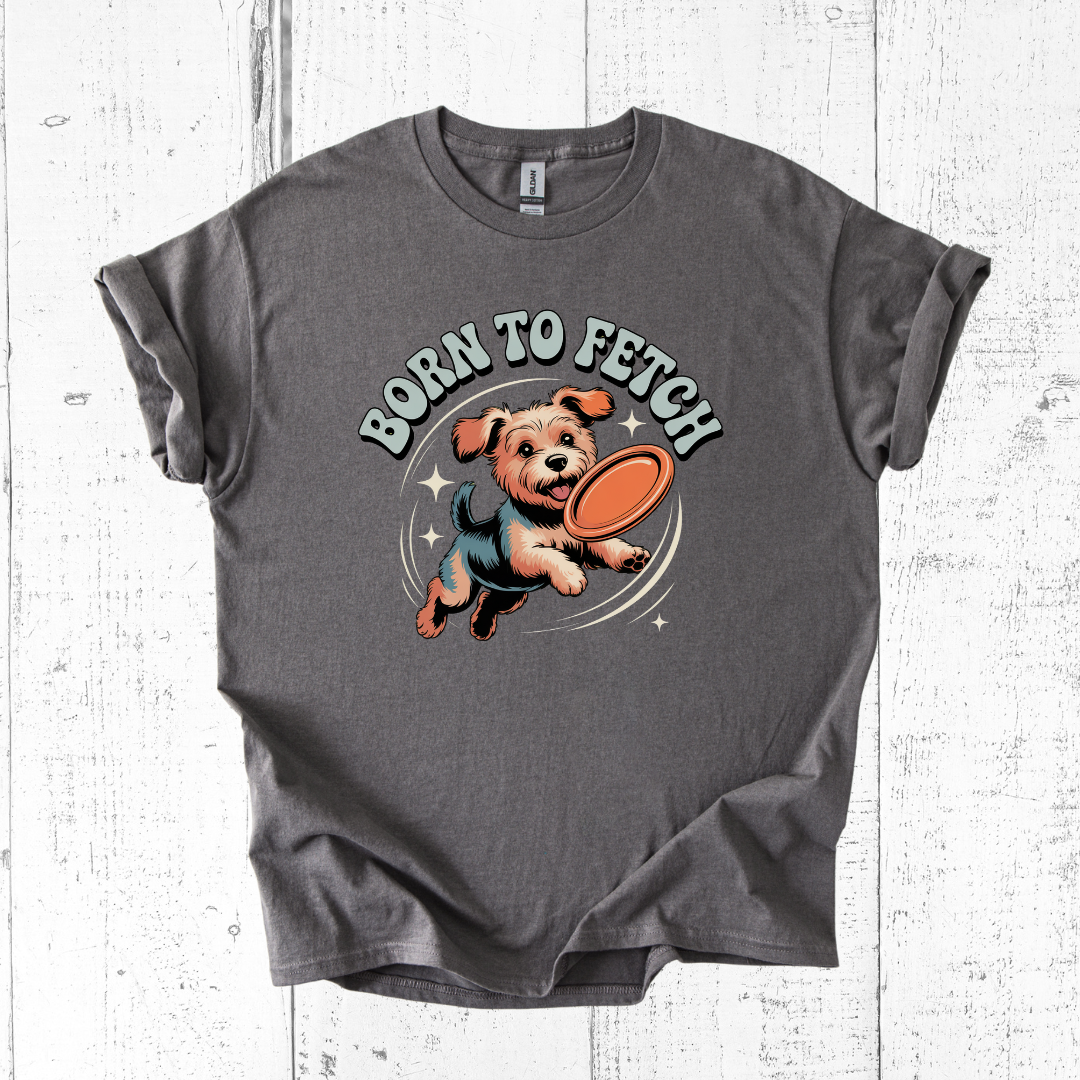 Gray t-shirt with a dog graphic and 'Born to Fetch' text on a wooden surface