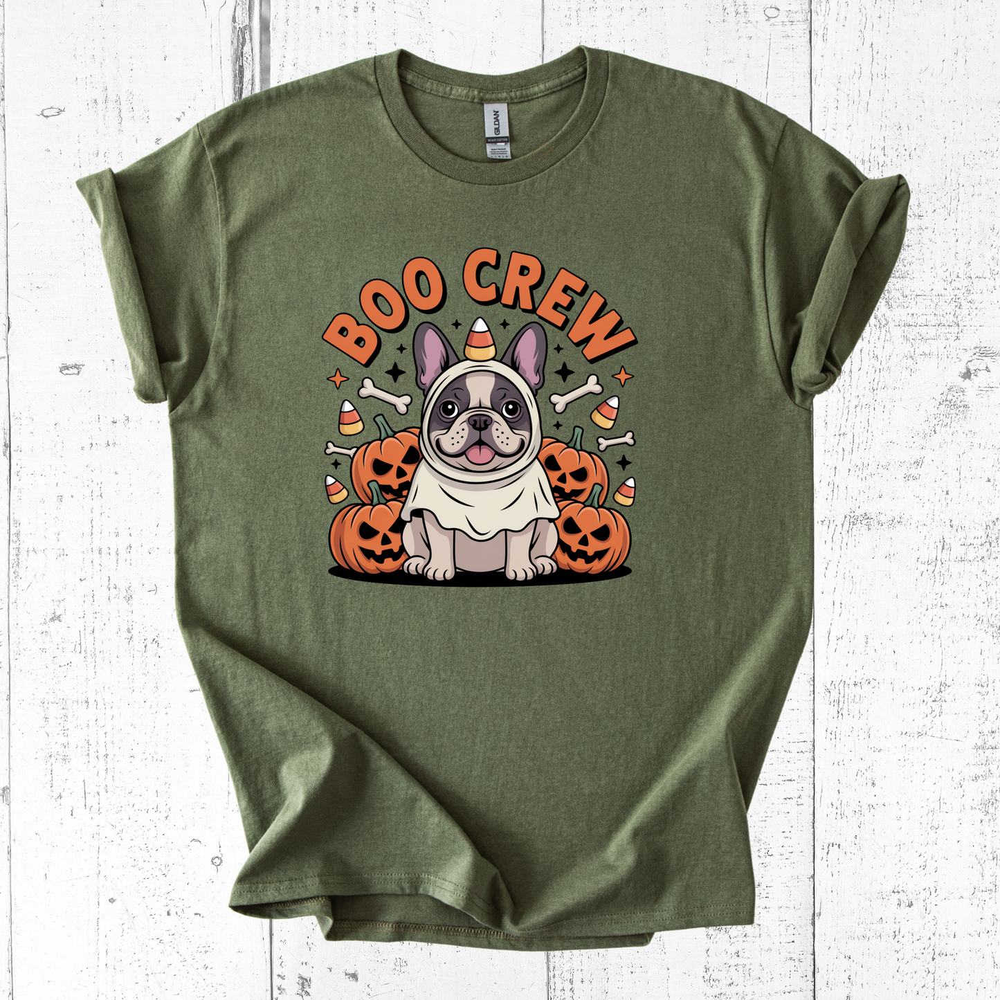 Green t-shirt with a Halloween-themed design featuring a dog and 'Boo Crew' text on a white wooden background.