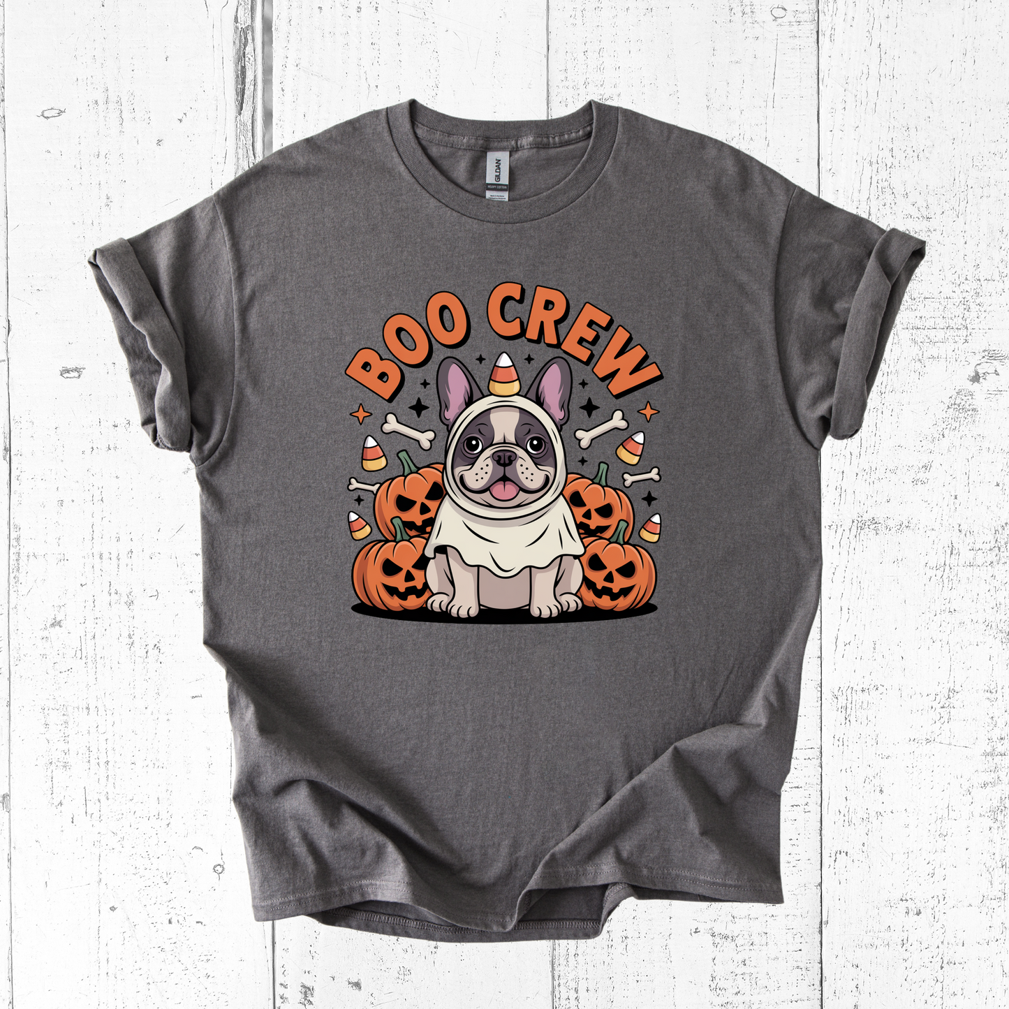 Gray t-shirt with Halloween-themed design featuring a dog in a costume and 'BOO CREW' text on a white wooden background.