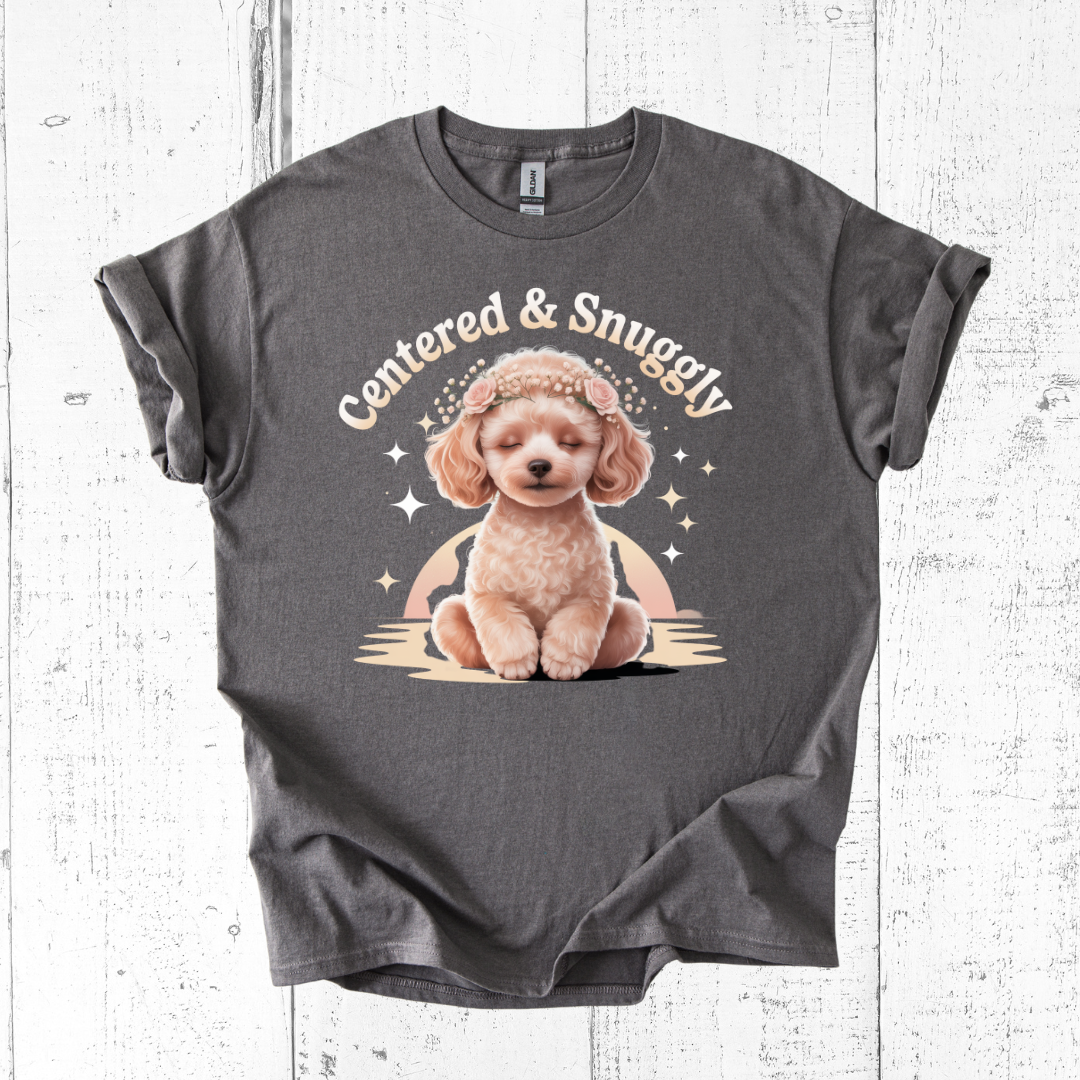 Gray t-shirt with a dog graphic and 'Centered & Snuggly' text on a wooden surface