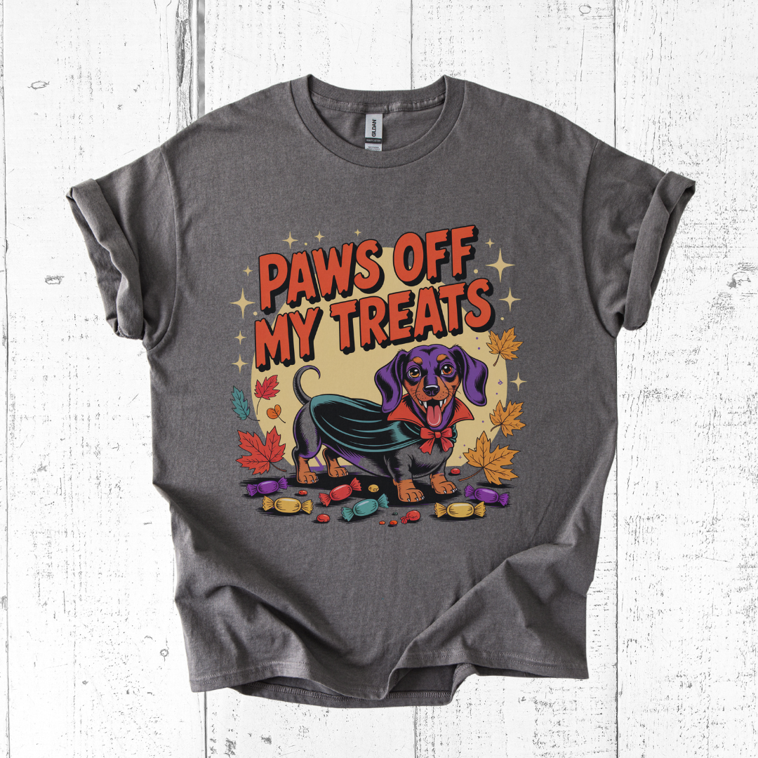 Gray t-shirt with a dog graphic and 'Paws Off My Treats' text on a white wooden background