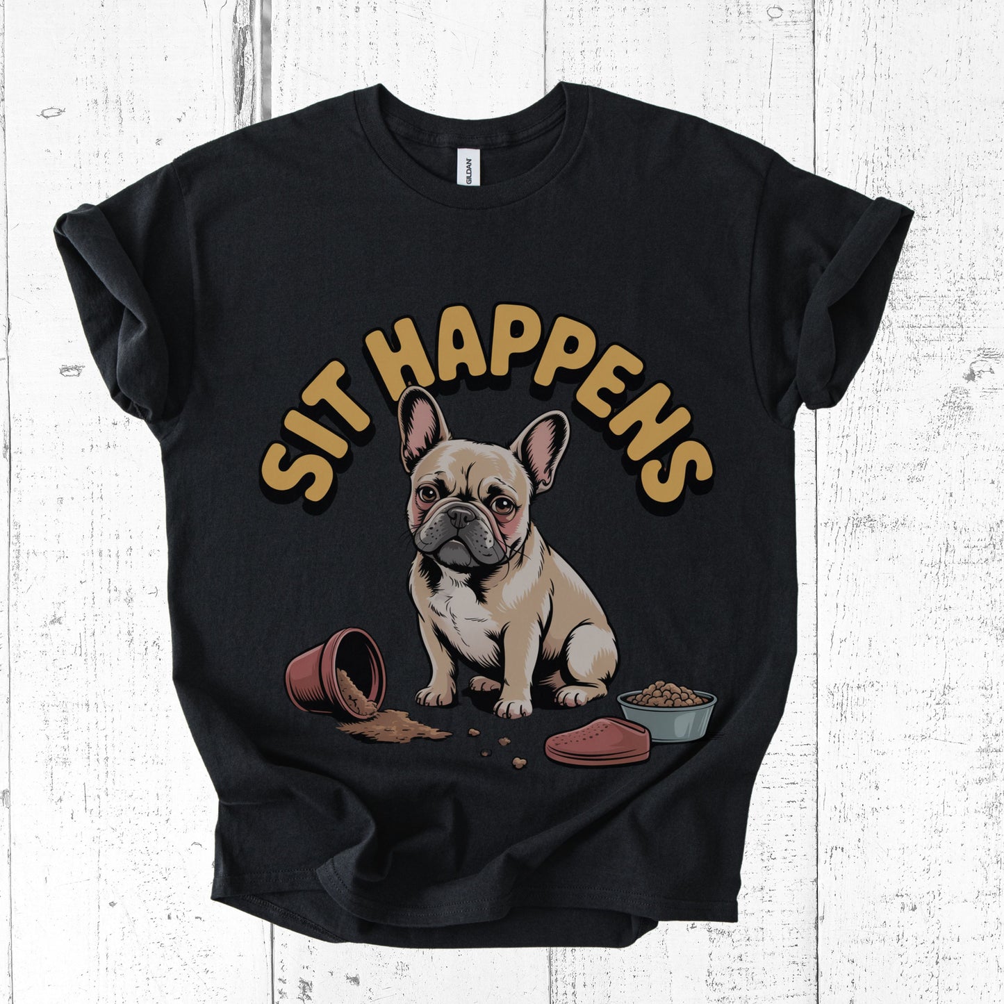 Black t-shirt with a dog graphic and 'Sit Happens' text on a white wooden background