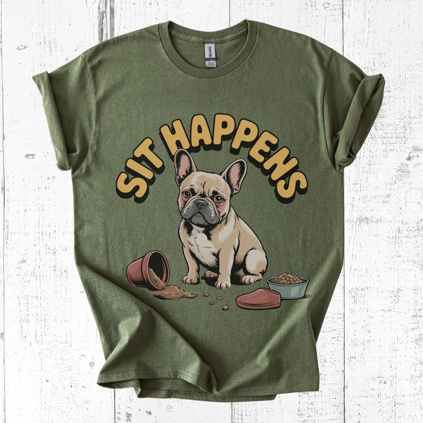 Green t-shirt with a dog graphic and 'SIT HAPPENS' text on a white wooden background