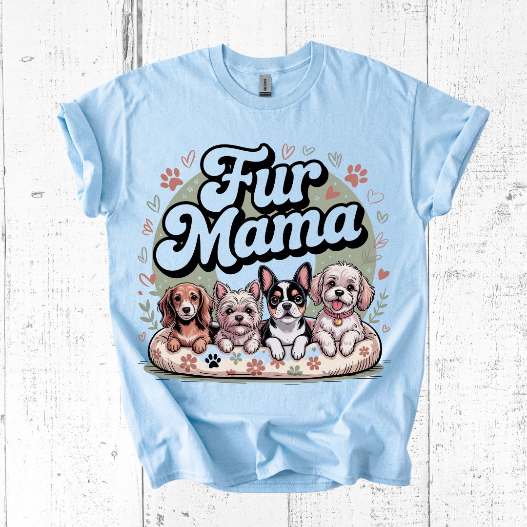 Light blue t-shirt with 'Fur Mama' graphic featuring cartoon dogs on a white wooden background