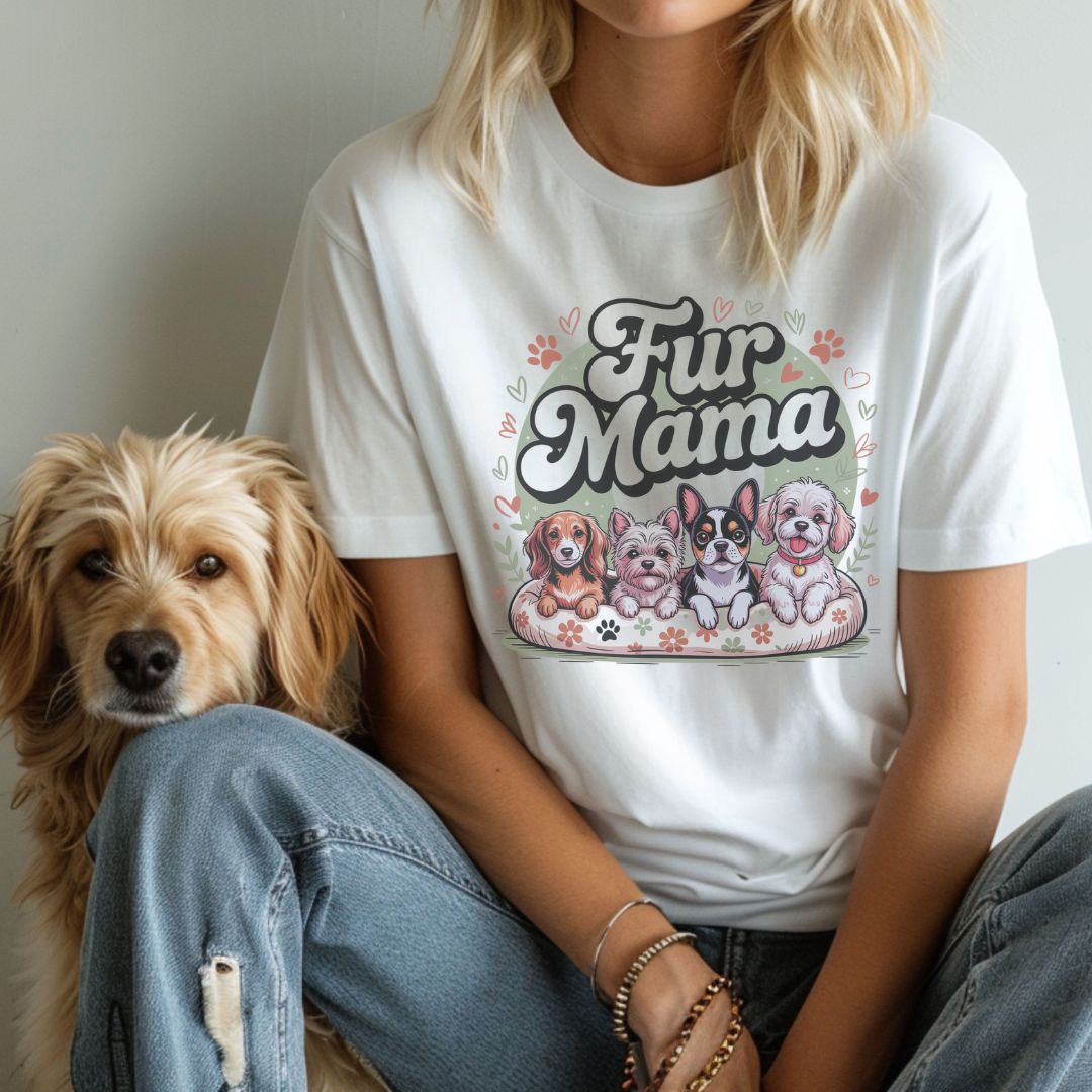 Person wearing a 'Fur Mama' t-shirt with dog illustrations, sitting next to a dog.