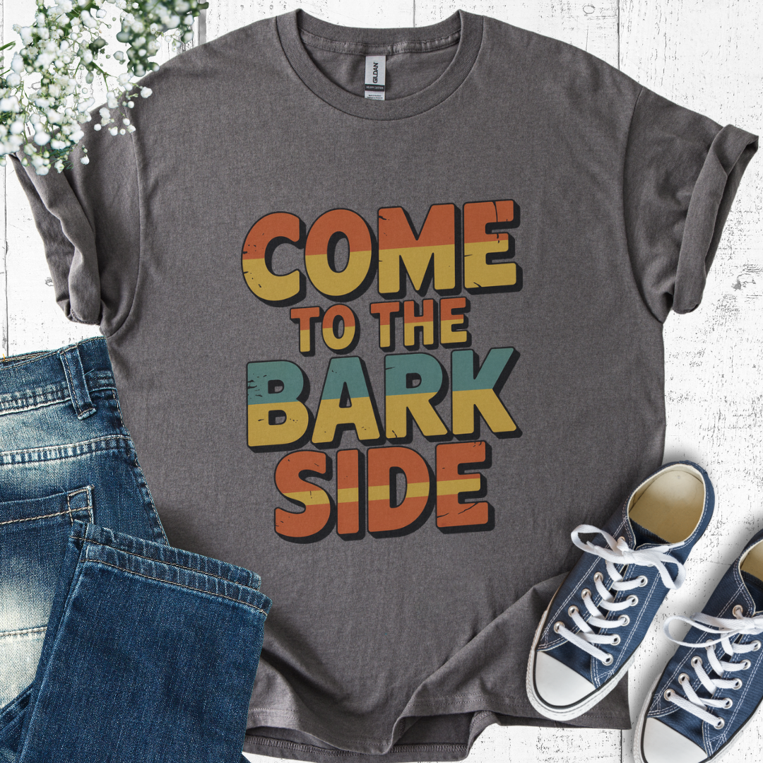 Gray t-shirt with 'Come to the Bark Side' text, paired with jeans and sneakers on a light wooden surface.