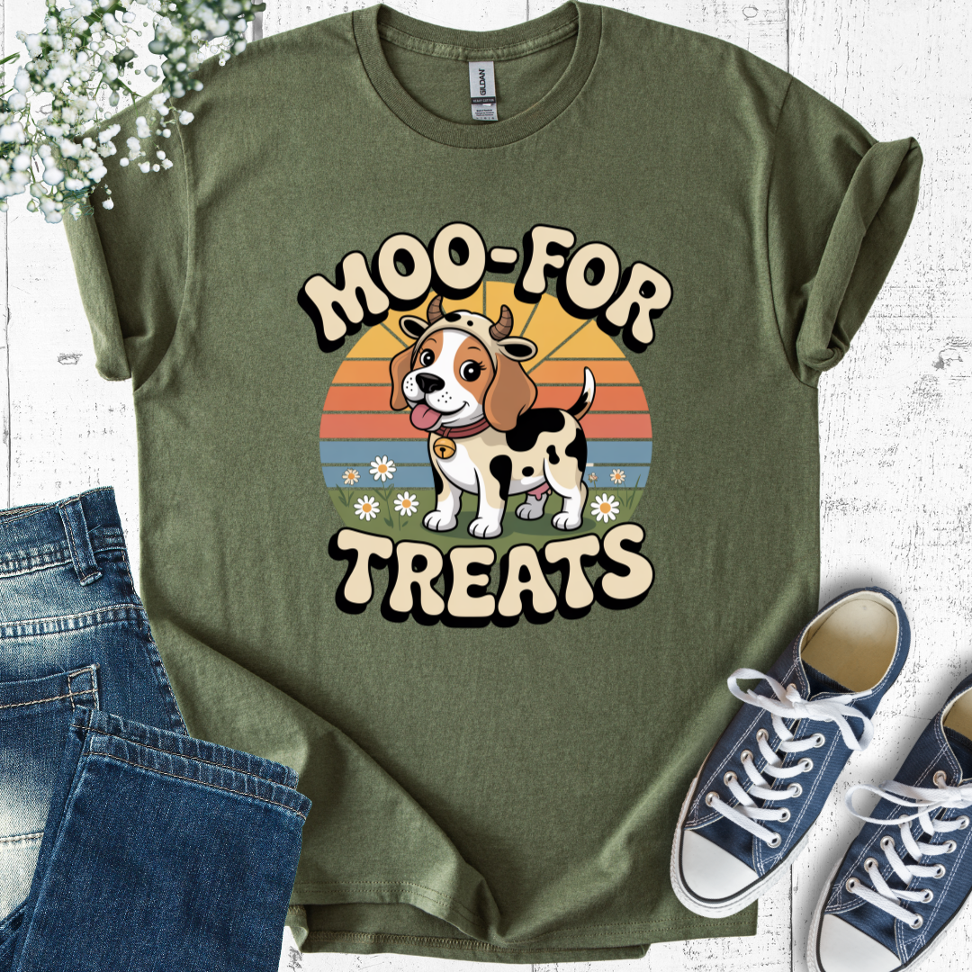 Green t-shirt with a cow-themed graphic and text, paired with jeans and sneakers on a light wooden surface.