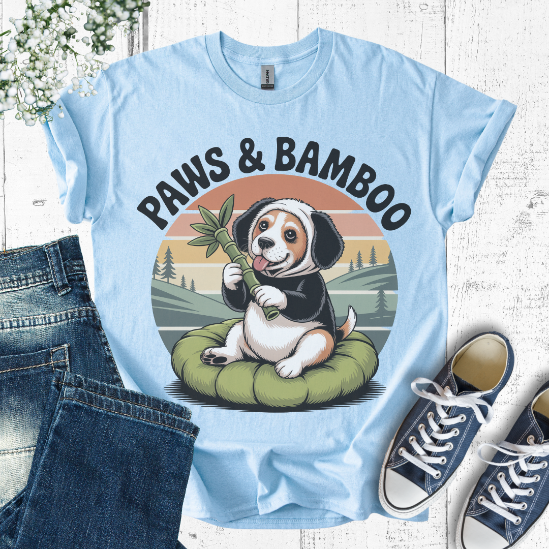 Light blue t-shirt with a dog graphic and 'Paws & Bamboo' text, displayed with jeans and sneakers.