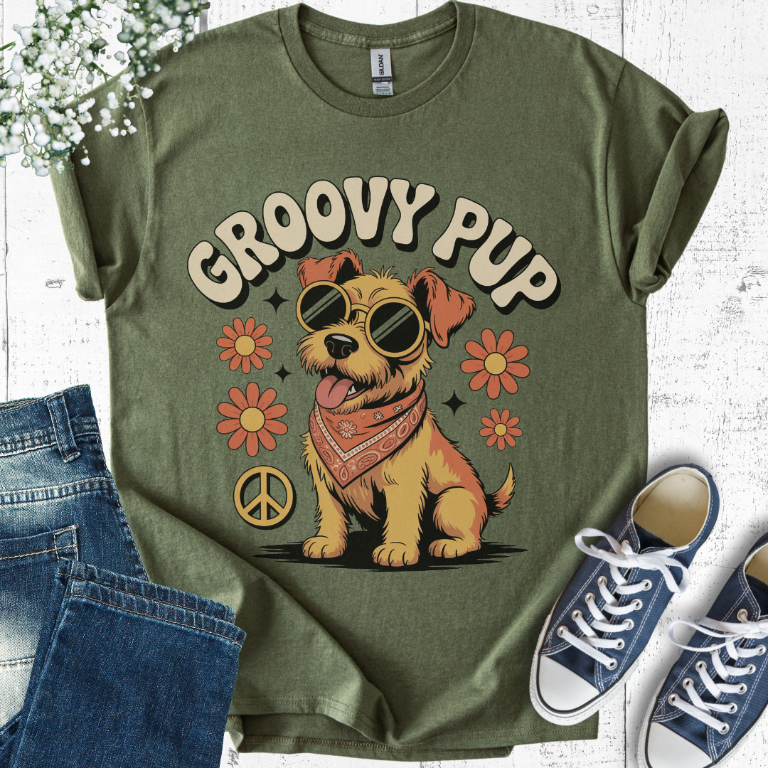 Green t-shirt with 'Groovy Pup' design, sunglasses-wearing dog, flowers, and peace symbol on a white background.