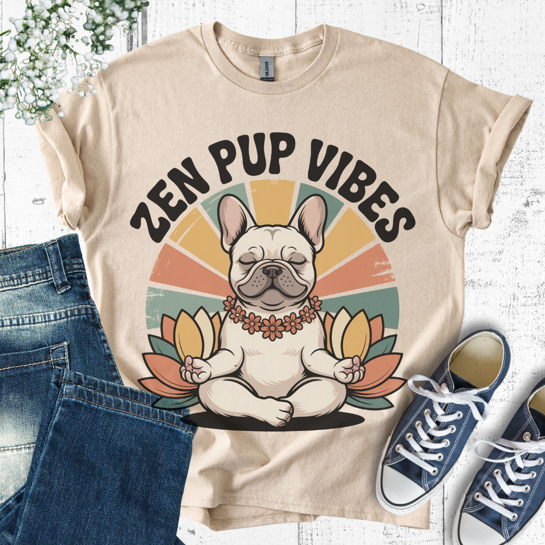 Beige t-shirt with 'Zen Pup Vibes' design featuring a dog in a meditative pose, paired with blue jeans and sneakers on a white background.