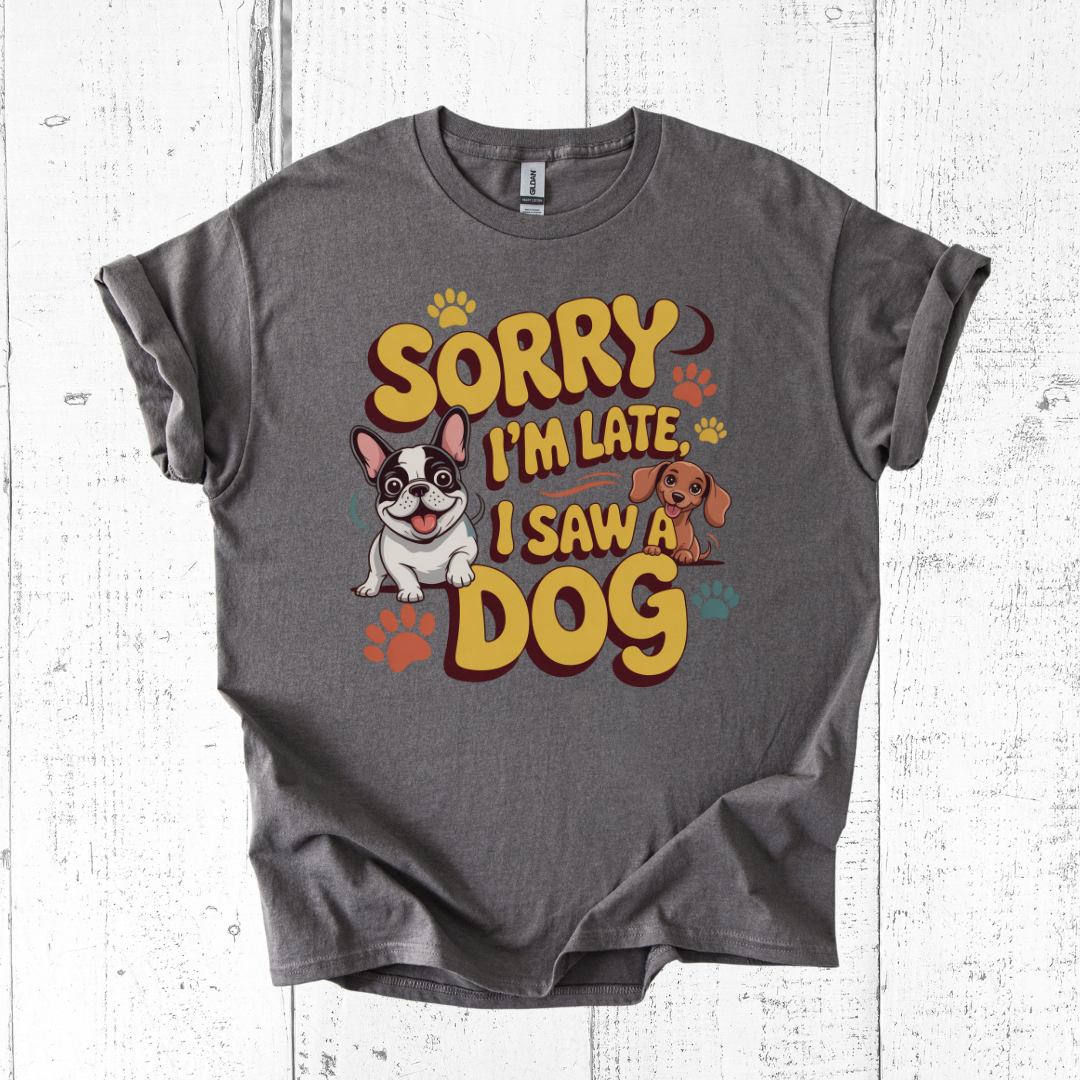 Gray t-shirt with 'Sorry I'm Late, I Saw a Dog' graphic on a white wooden background