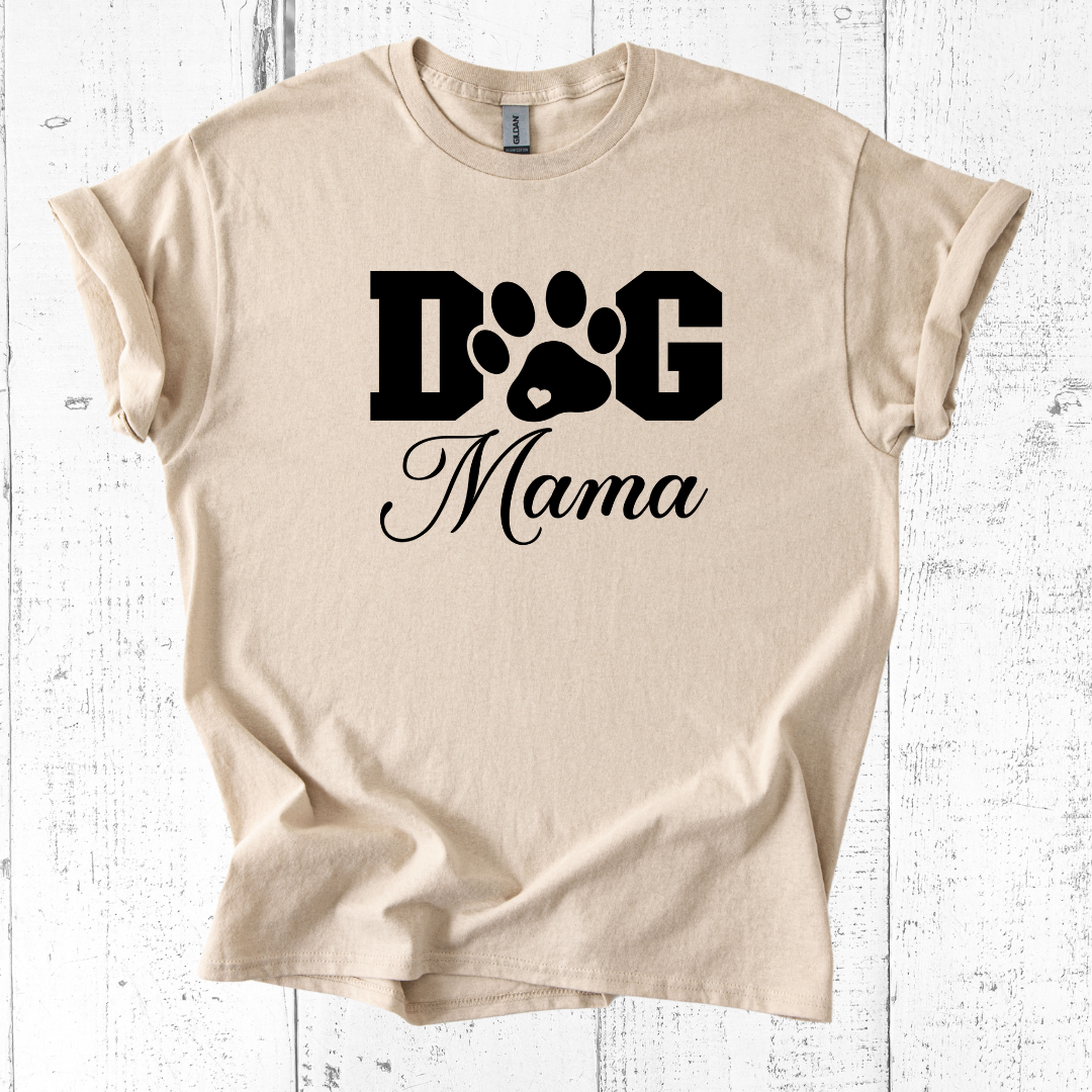 Beige t-shirt with 'Dog Mama' text and paw print design on a white wooden background