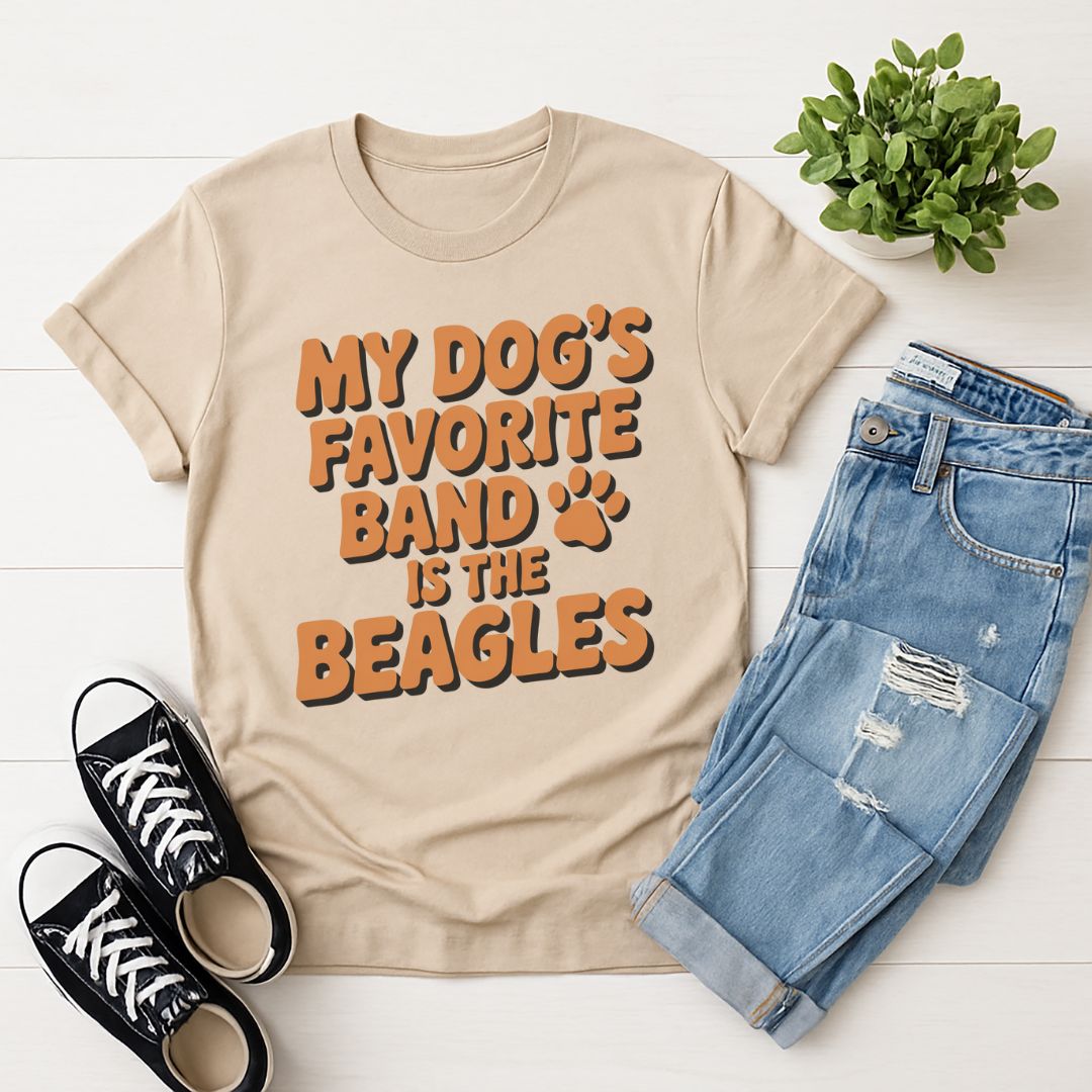 Sand Beige Gildan 6400 unisex t-shirt with retro dog graphic and ‘My Dog's Favorite Band Is The Beagles’ text, perfect for dog lovers.