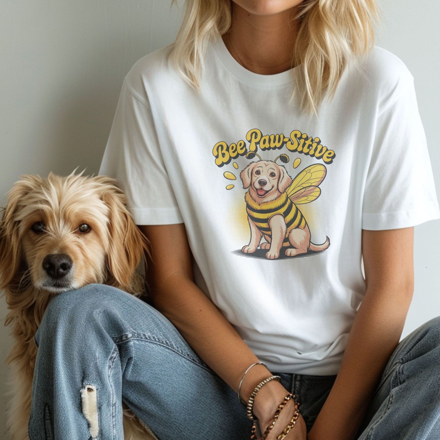 White unisex t-shirt with retro dog graphic and āBee Paw-Sitiveā text, perfect for dog lovers.