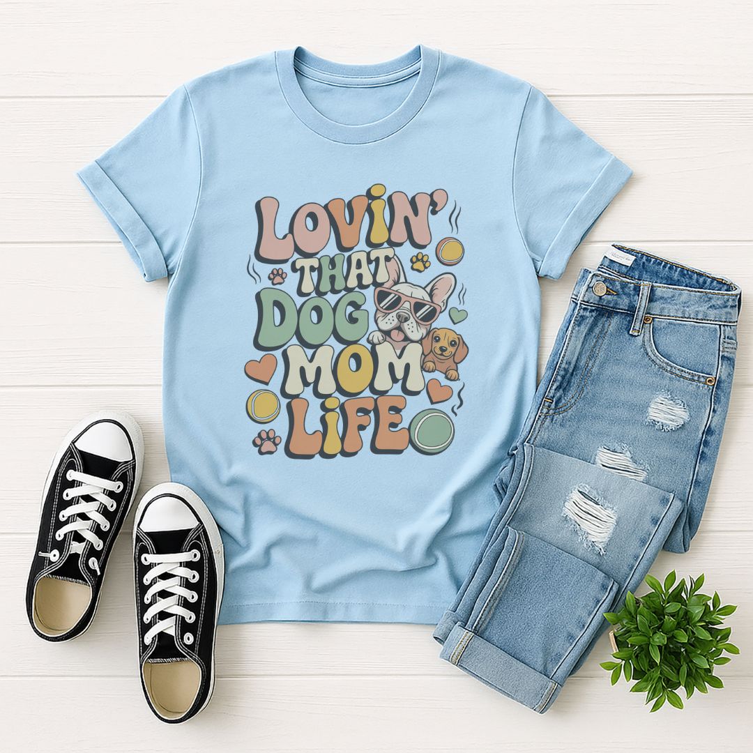 Light blue Gildan 6400 unisex t-shirt with retro dog graphic and ‘Lovin' That Dog Mom Life' text, perfect for dog lovers.