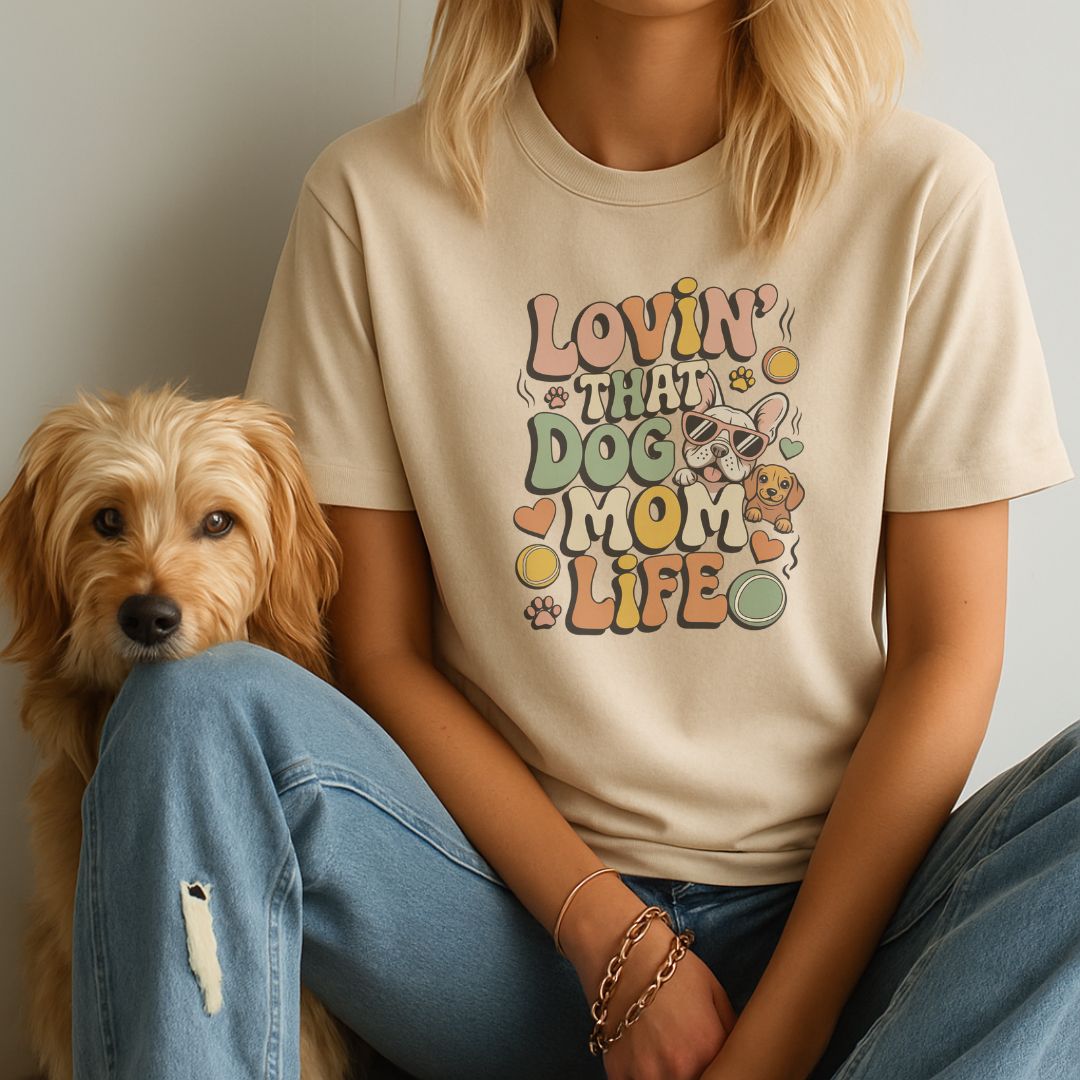 Sand Beige unisex t-shirt with retro dog graphic and ‘Lovin' That Dog Mom Life' text, perfect for dog lovers.