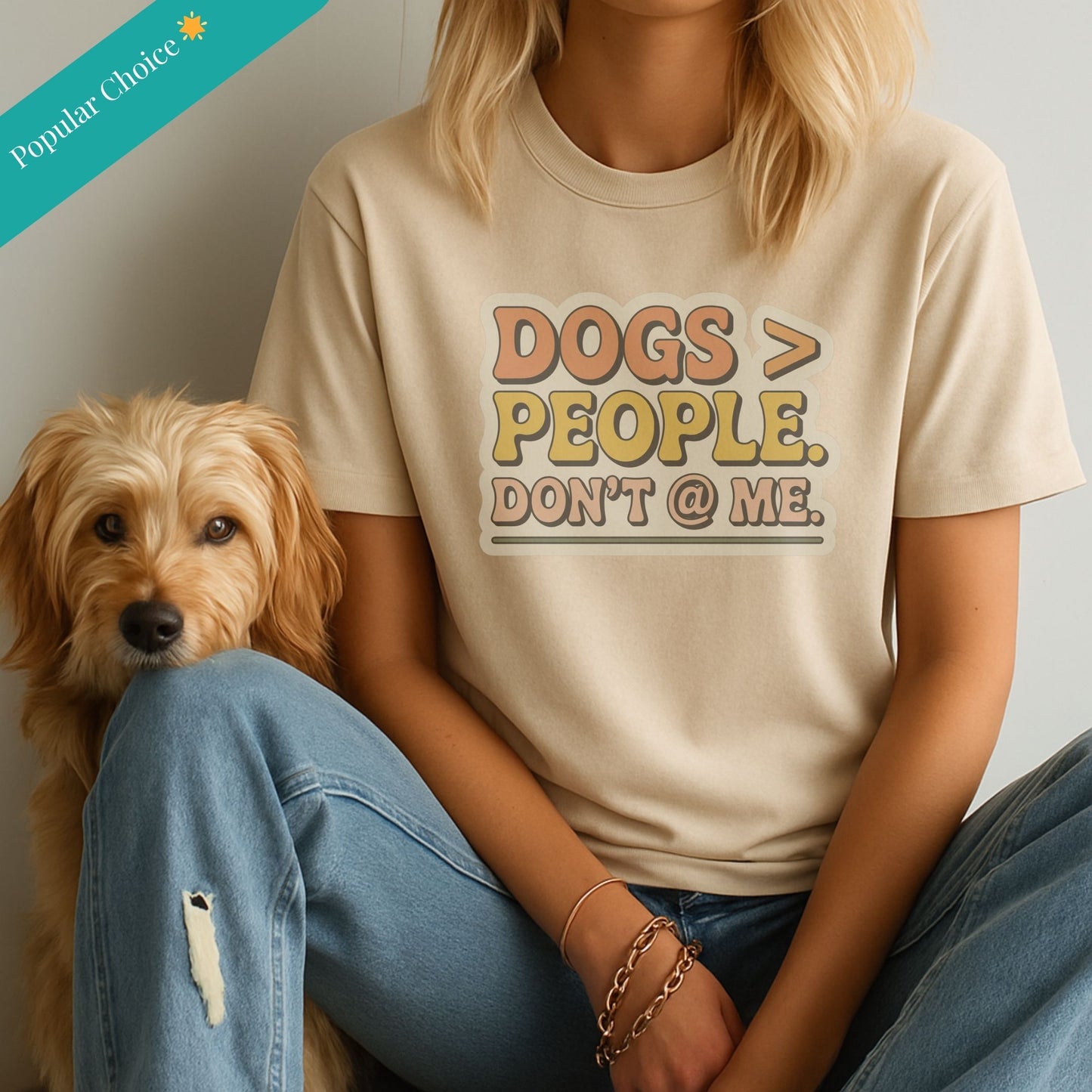 Sand Beige Gildan 6400 unisex t-shirt with retro dog graphic and ‘Dogs > People. Don't @ Me’ text, perfect for dog lovers.