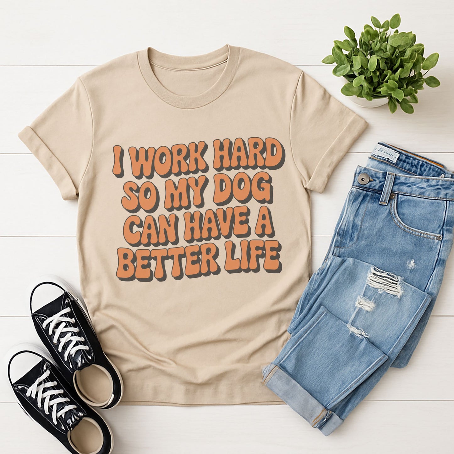 Sand Beige Gildan 6400 unisex t-shirt with retro dog graphic and ‘I WORK HARD SO MY DOG CAN HAVE A BETTER LIFE’ text, perfect for dog lovers.