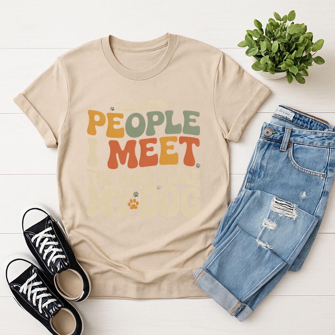 Sand Beige Gildan 6400 unisex t-shirt with retro dog graphic and ‘The More People I Meet The More I Like My Dog’ text, perfect for dog lovers.