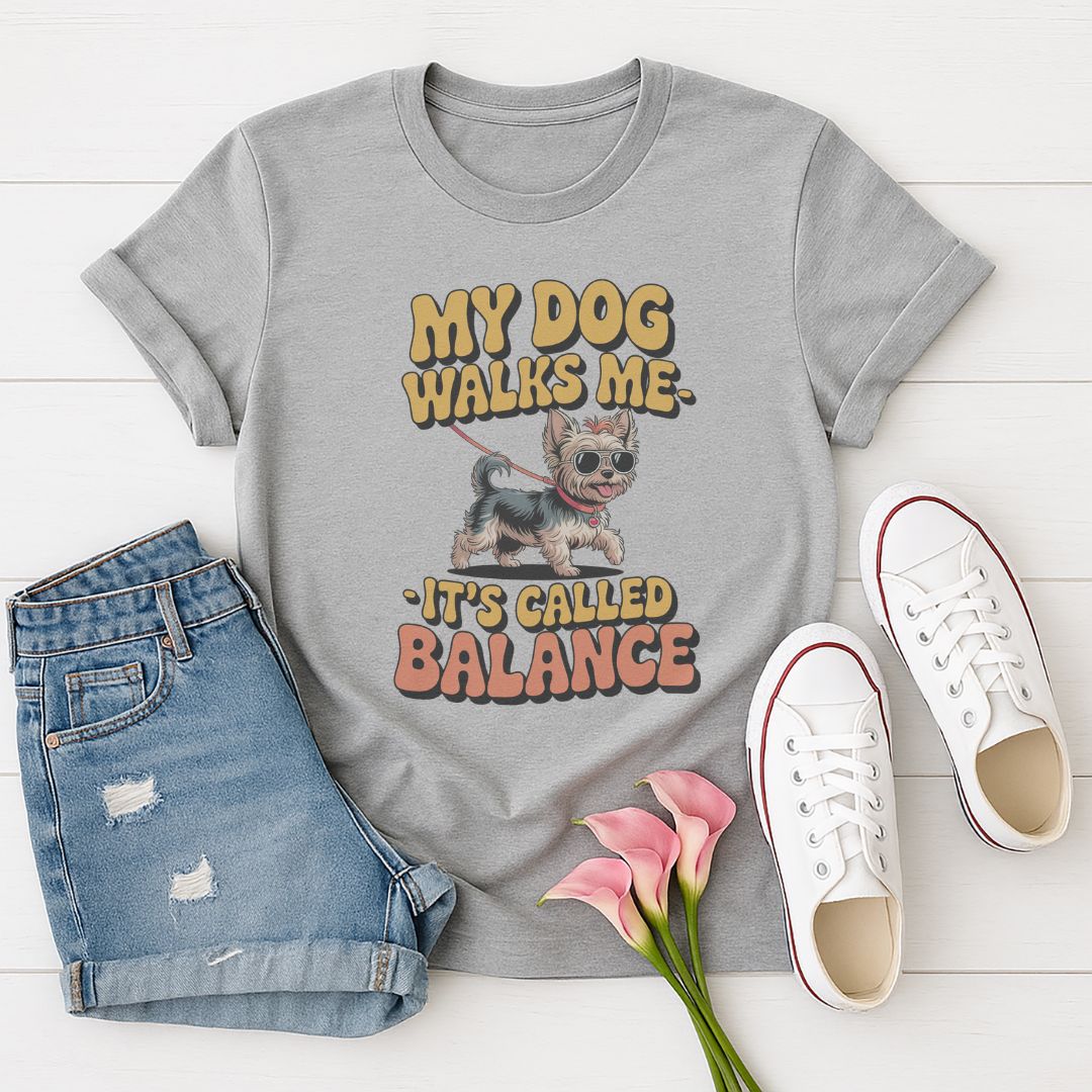 Sport Gray Gildan 6400 unisex t-shirt with retro dog graphic and ‘My Dog Walk Me - It's Called Balance' text, perfect for dog lovers.