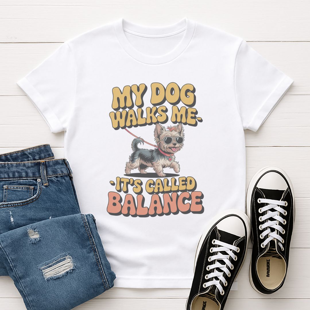 White Gildan 6400 unisex t-shirt with retro dog graphic and ‘My Dog Walk Me - It's Called Balance' text, perfect for dog lovers.