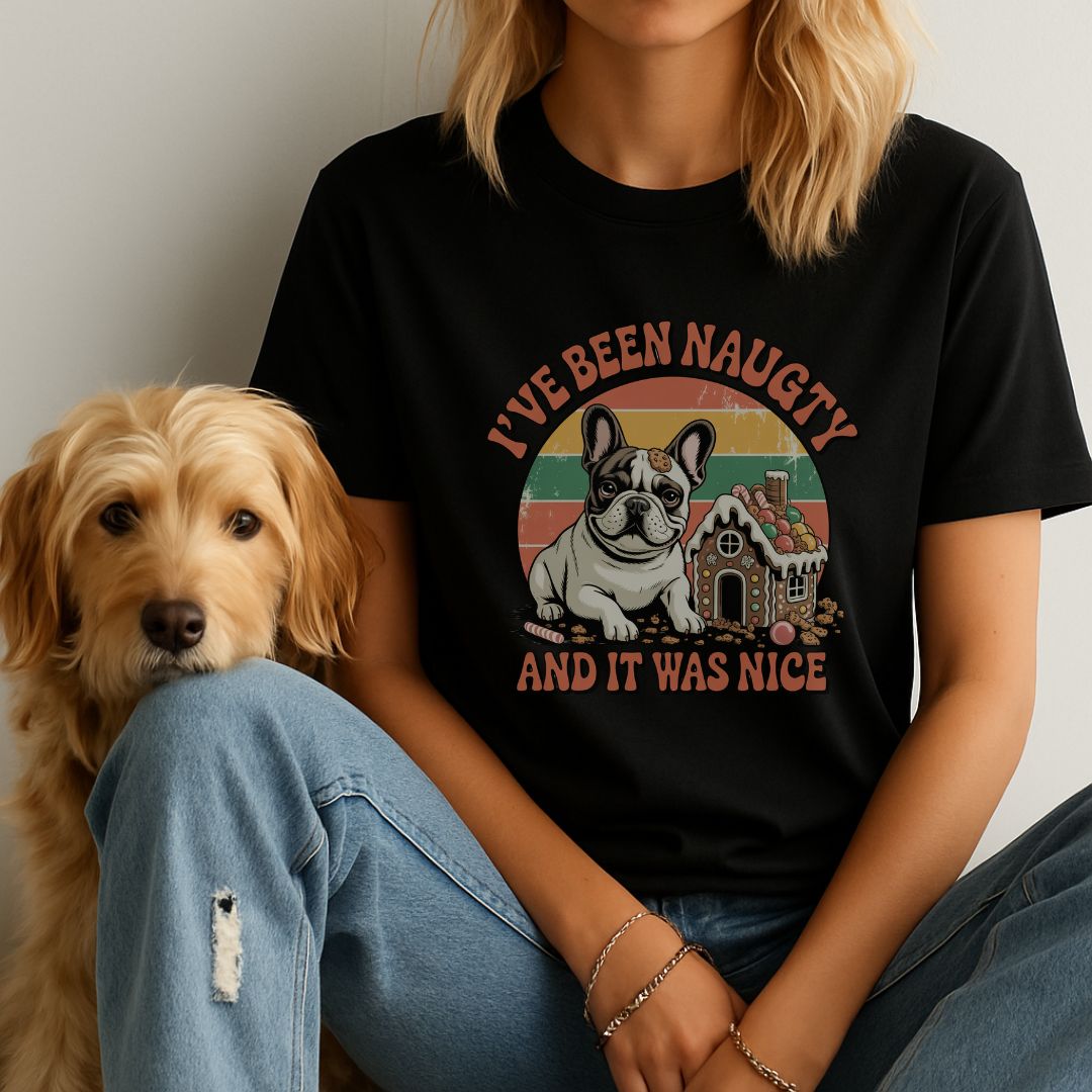 Black unisex t-shirt with retro dog graphic and ‘I've Been Naughty And It Was Nice' text, perfect for dog lovers.
