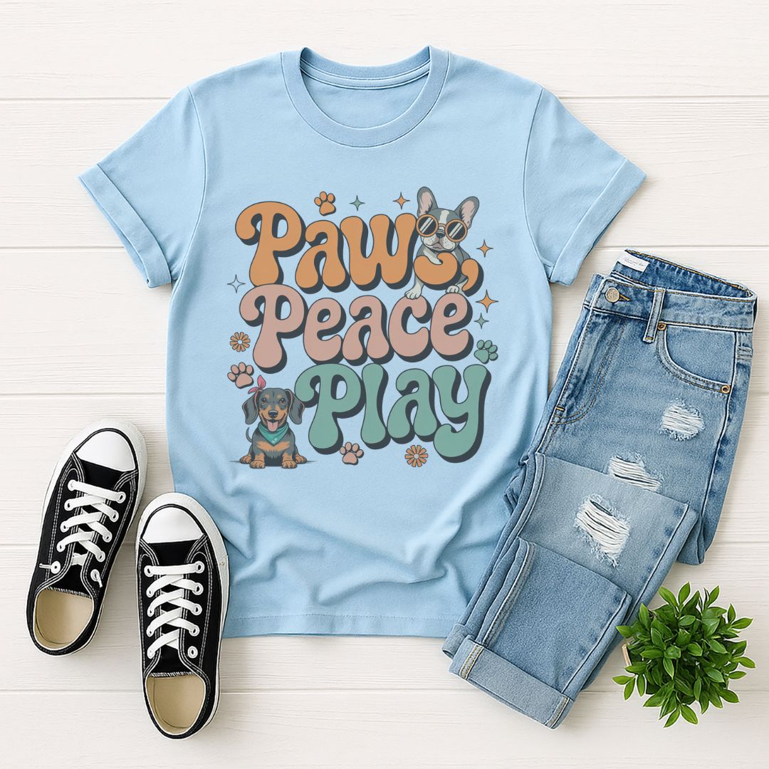 Light blue Gildan 6400 unisex t-shirt with retro dog graphic and ‘Paws, Peace, Play' text, perfect for dog lovers.