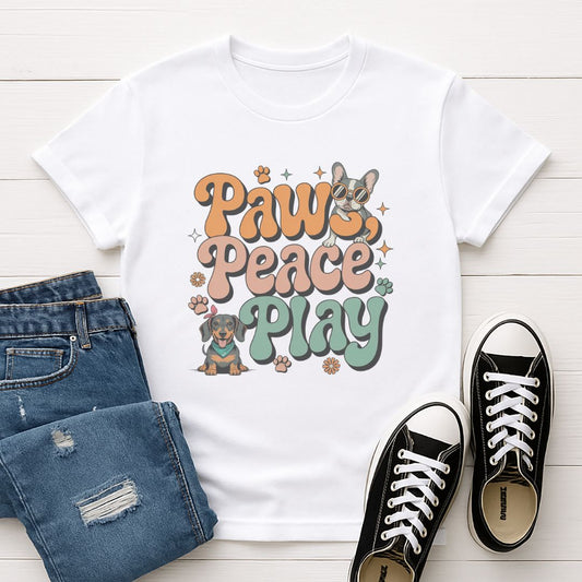 White Gildan 6400 unisex t-shirt with retro dog graphic and โPaws, Peace, Play' text, perfect for dog lovers.