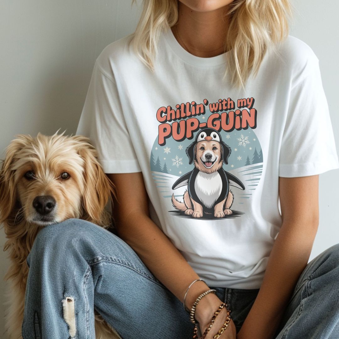 White unisex t-shirt with retro dog graphic and ‘Chillin' with my PUP-GUIN’ text, perfect for dog lovers.