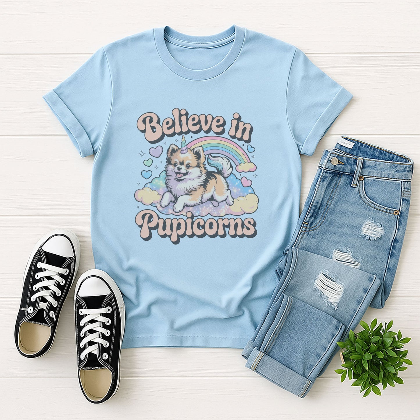 Light Blue Gildan 6400 unisex t-shirt with retro dog graphic and ‘Believe in Pupicorns’ text, perfect for dog lovers.