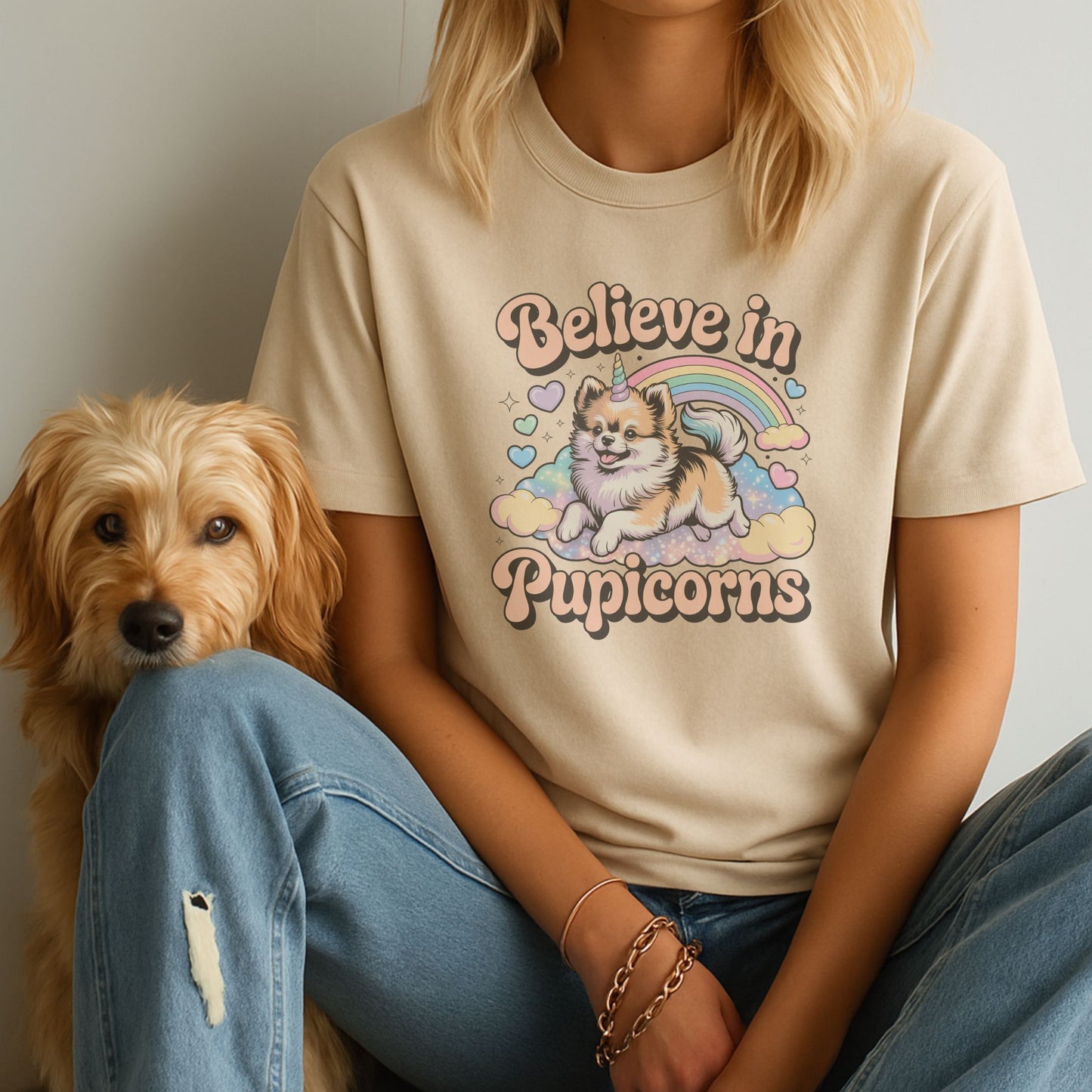 Sand unisex t-shirt with retro dog graphic and ‘Believe in Pupicorns’ text, perfect for dog lovers.