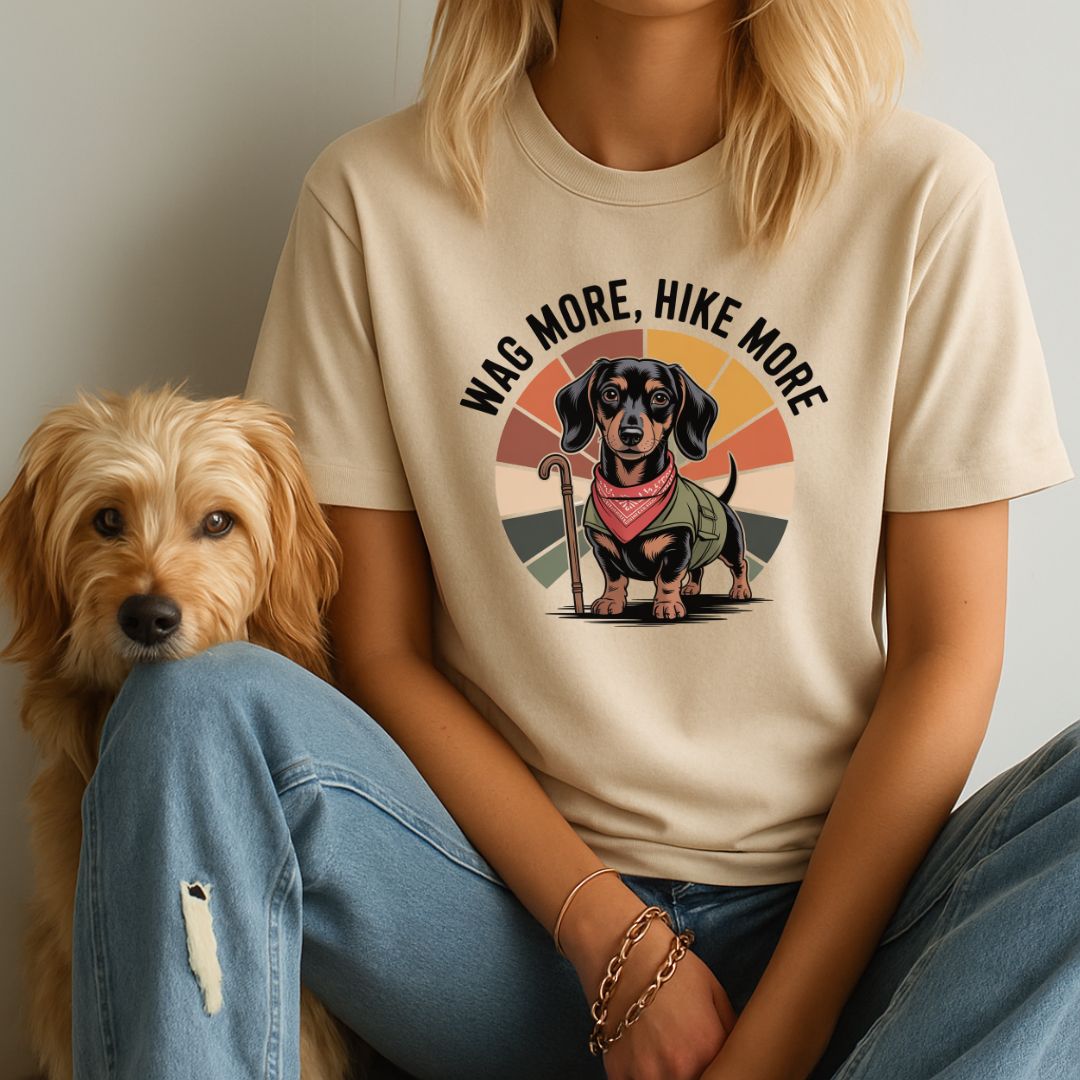 Sand Beige Gildan 6400 unisex t-shirt with retro dog graphic and ‘Wag More, Hike More.’ text, perfect for dog lovers.
