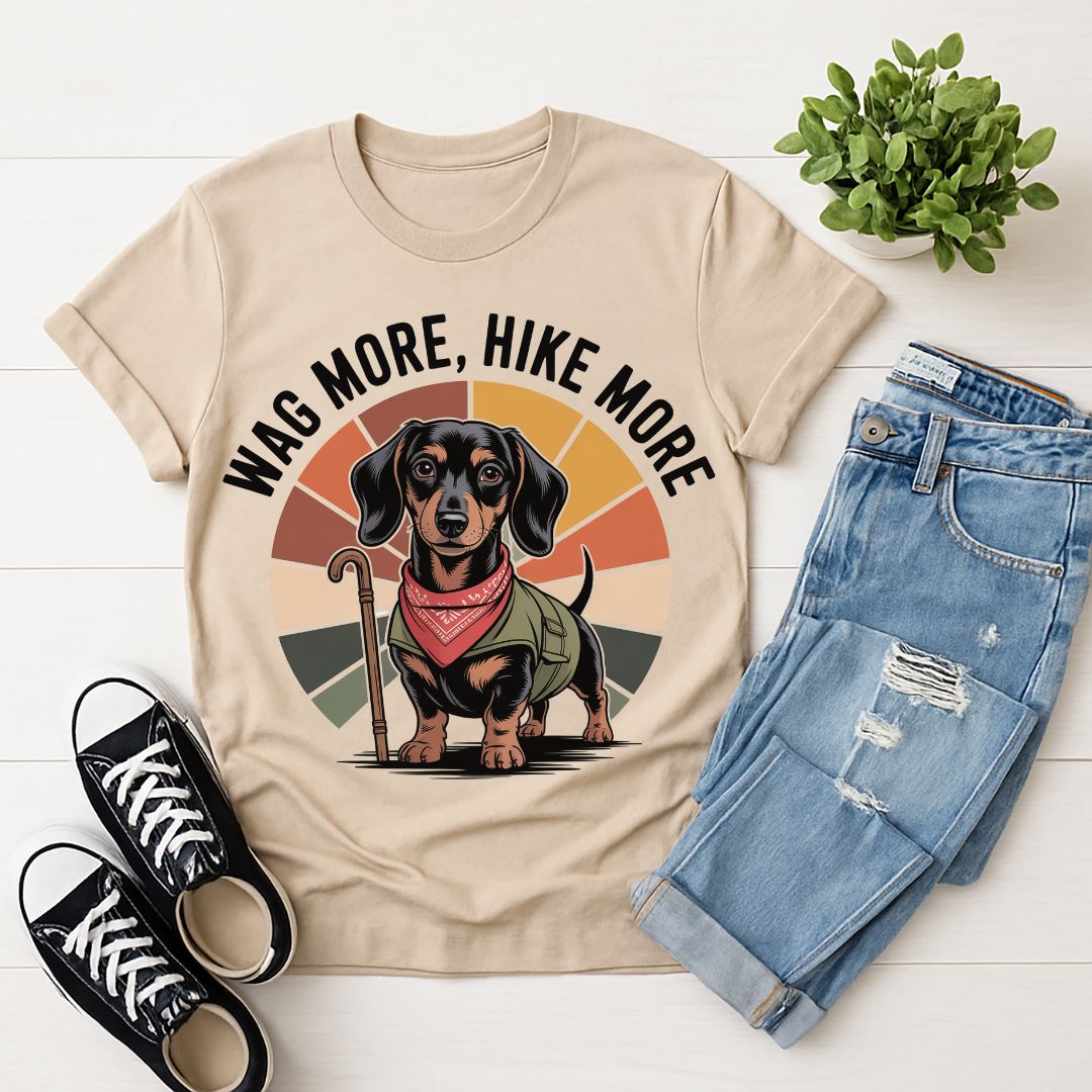 Sand Beige Gildan 6400 unisex t-shirt with retro dog graphic and ‘Wag More, Hike More.’ text, perfect for dog lovers.