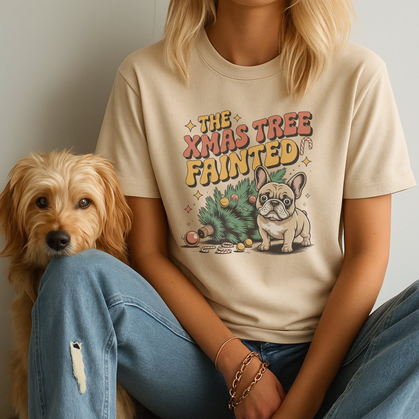 Unisex t-shirt with retro dog graphic and ‘The Xmas Tree Fainted' text, perfect for dog lovers.