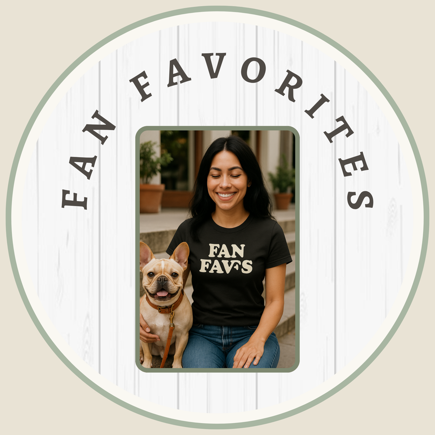 Smiling woman with long black hair wearing a black 'Fan Favs' t-shirt sitting next to her happy French Bulldog. Dog lover lifestyle image for Pupperazzi Gear fan favorite collection.