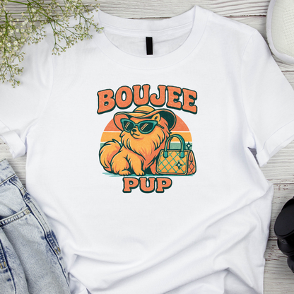 White t-shirt with 'BOUJEE PUP' graphic design featuring a dog with sunglasses and a handbag on a wooden surface.