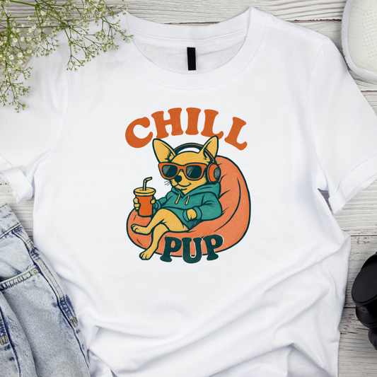 White t-shirt with a graphic of a dog wearing sunglasses and headphones, holding a drink, with 'CHILL PUP' text.