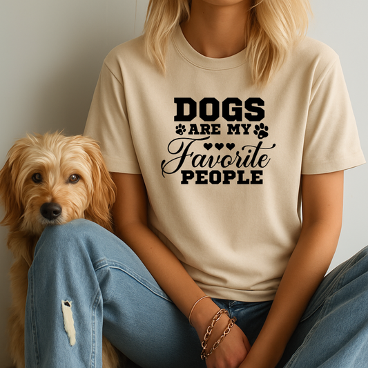Person wearing a t-shirt with 'DOGS ARE MY FAVORITE PEOPLE' text sitting next to a dog.