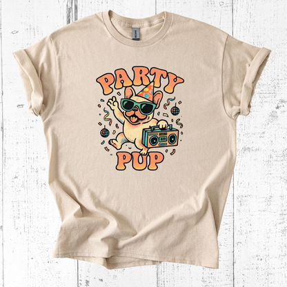 Beige t-shirt with 'Party Pup' graphic design on a white wooden background
