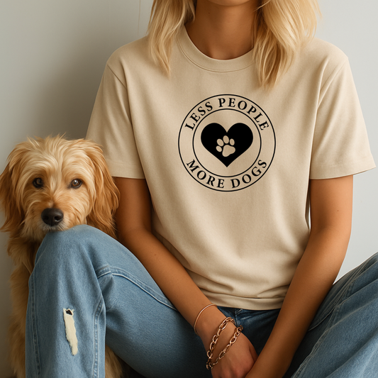 Person wearing a t-shirt with 'Less People, More Dogs' design sitting next to a dog.