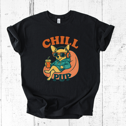 Black t-shirt with a graphic of a dog wearing sunglasses and headphones, and the text 'Chill Pup' on a white wooden background.