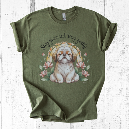 Green t-shirt with a dog graphic and text on a white wooden surface